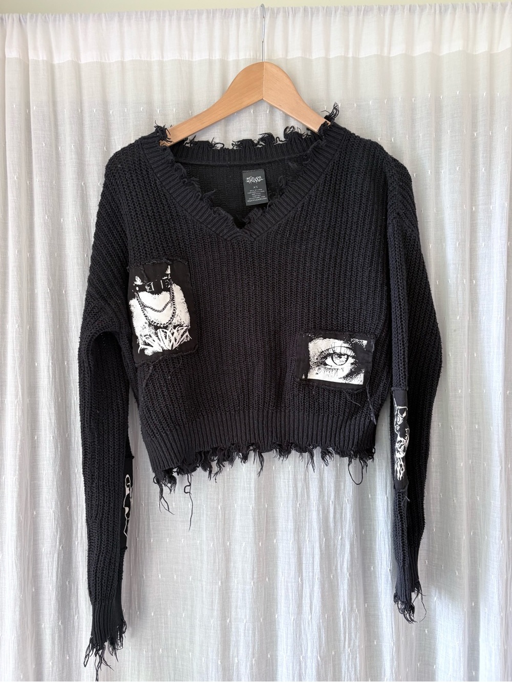Swixxz Black Distressed V-Neck Crop Sweater with Graphic Patches